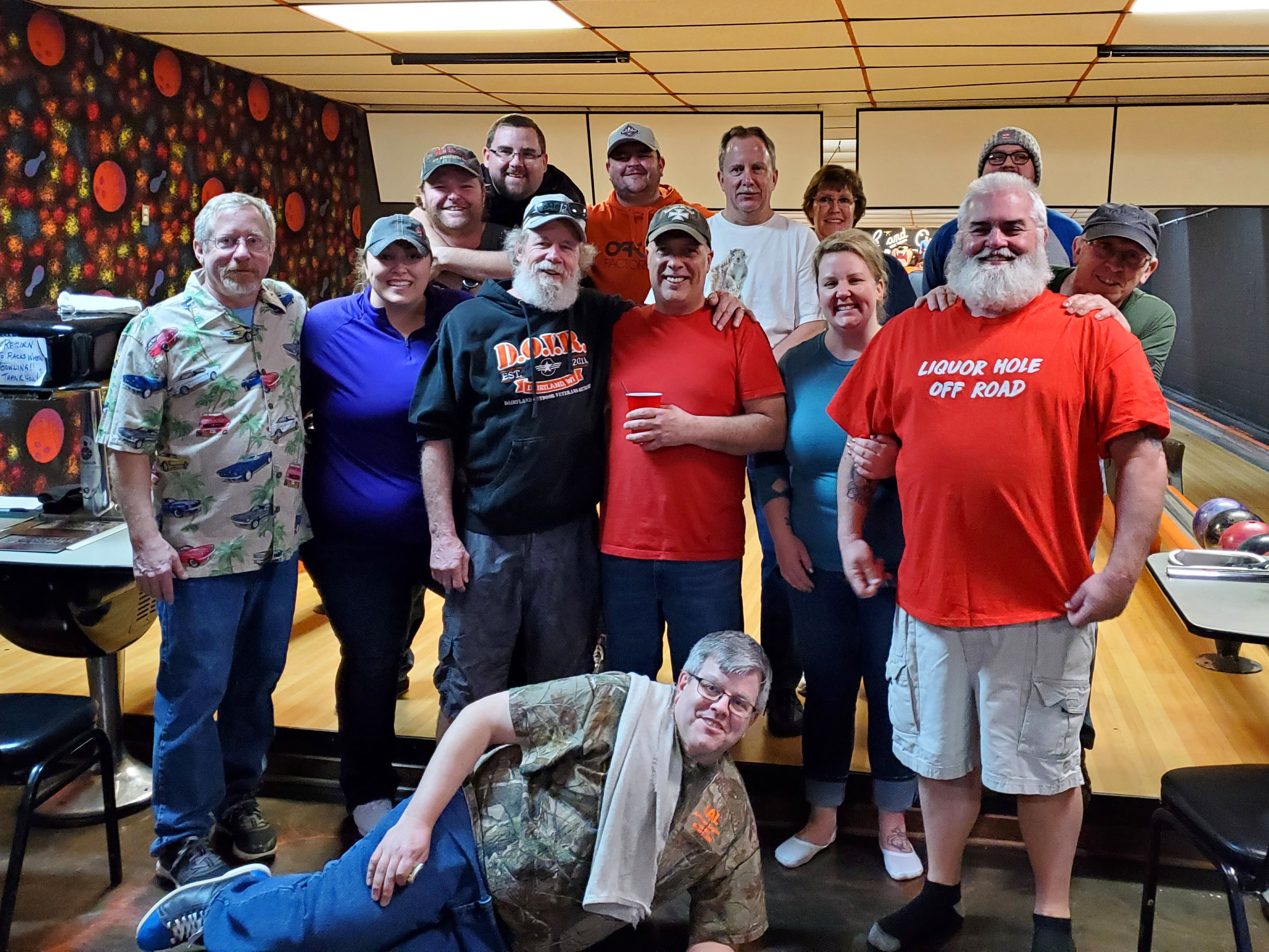 Friends enjoying food together at a bowling venue